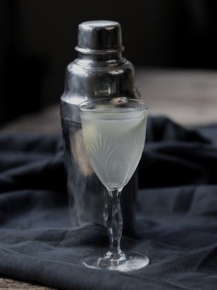 Corpse Reviver No.2 with cocktail shaker on black cloth